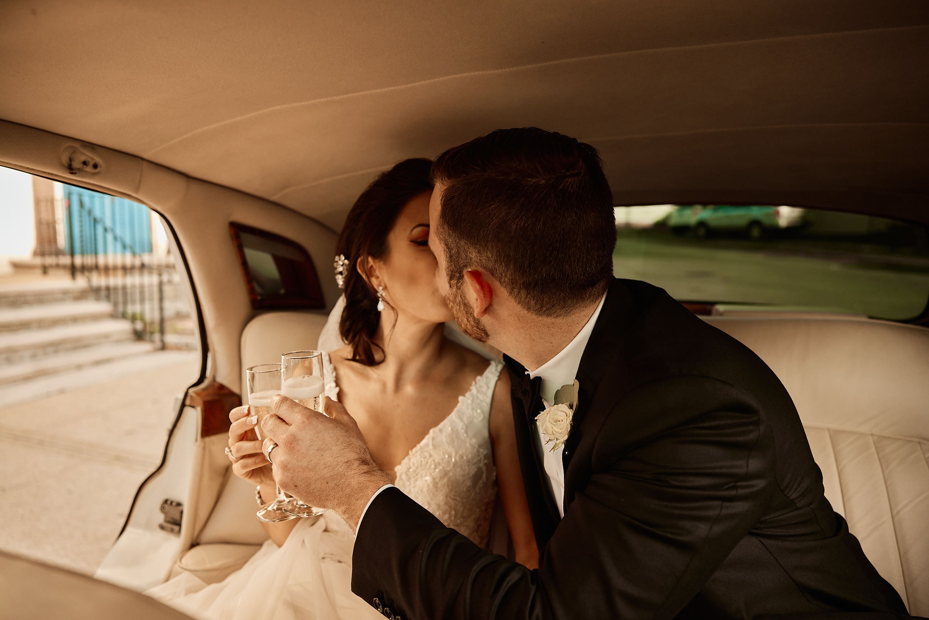 Romantic couple portrait in the back of a vintage car in Boston